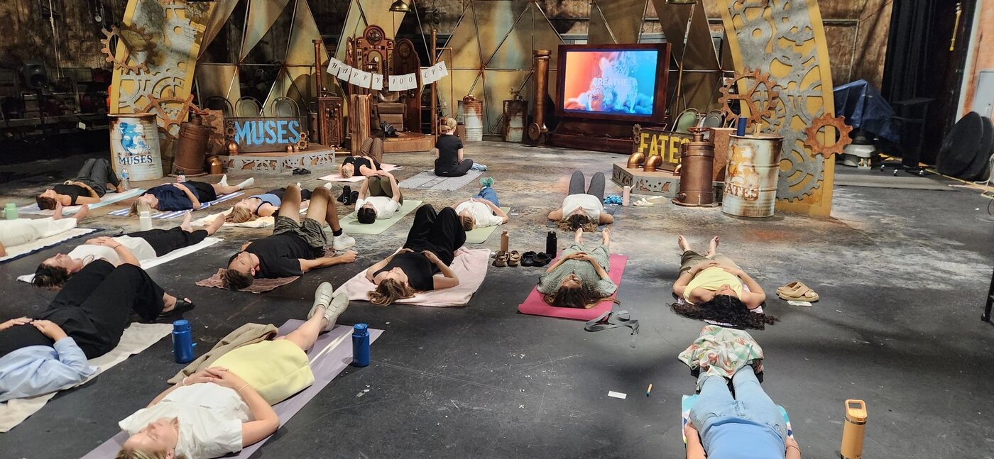 A large workplace group taking part in a Be Remindful breathwork session at Nine in Brisbane