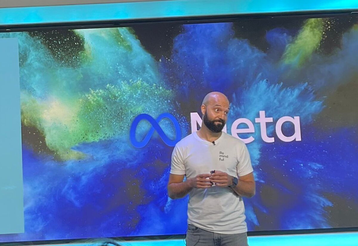 Daniel Augustine presenting a breathing session on stage at Meta.